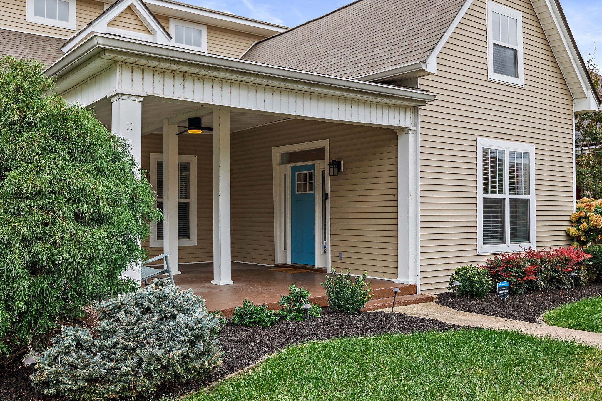 front view of a house with a yard