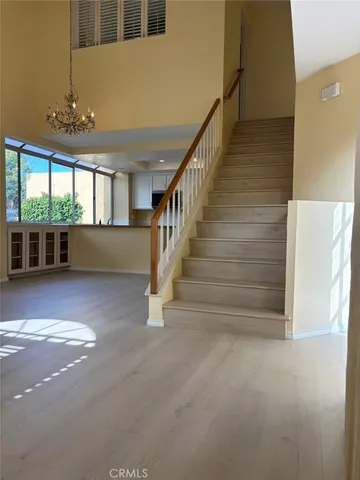 a view of entryway and hall with a front door