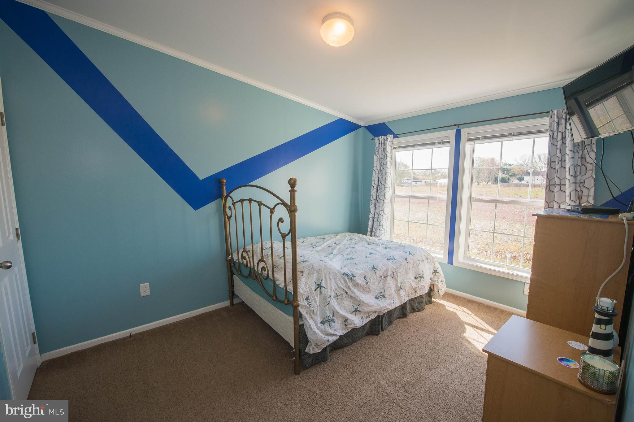 36388 Poplar Neck Road Willards, MD 21874 - Photo 31 of 34 a bed sitting in a room next to a window