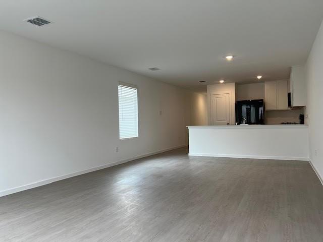 1038 Raintree Road Princeton, TX 75407 - Photo 13 of 36 a view of a kitchen with a sink and a microwave