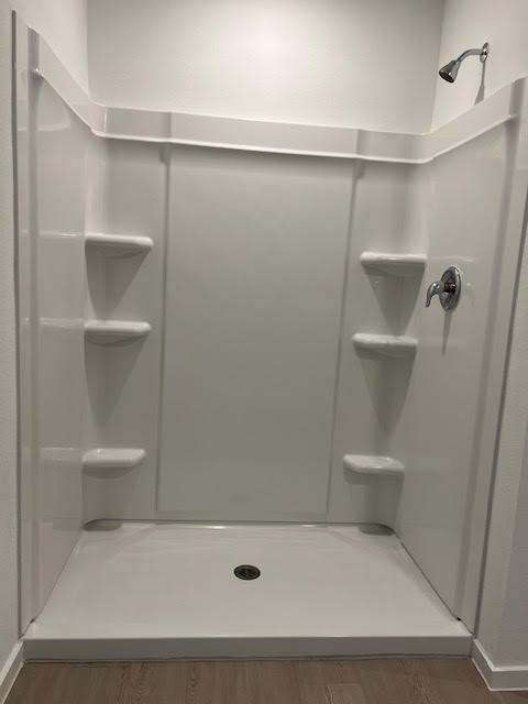 1038 Raintree Road Princeton, TX 75407 - Photo 17 of 36 a bathroom with a shower