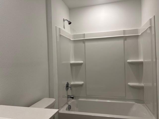 1038 Raintree Road Princeton, TX 75407 - Photo 23 of 36 a bathroom with a bathtub and a toilet