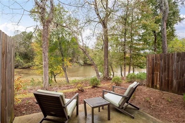a view of a outdoor space with lounge chairs