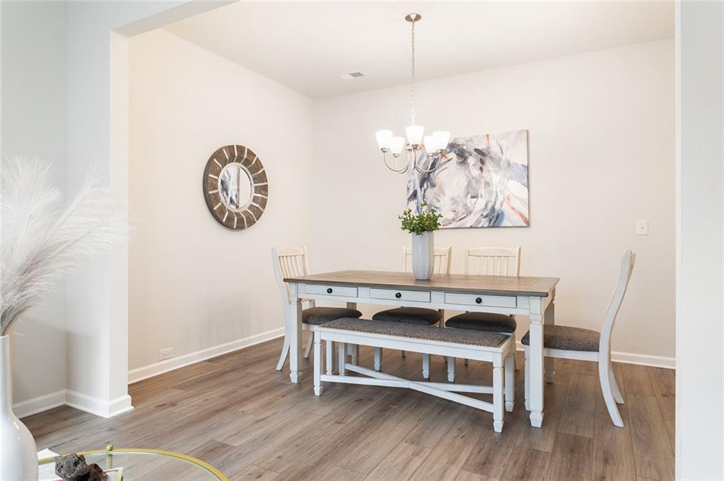 2824 Saratoga Lake View Decatur, GA 30034 - Photo 14 of 29 a view of a dining area with furniture and wooden floor