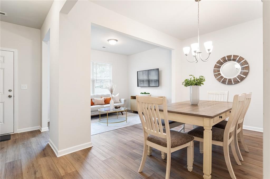 2824 Saratoga Lake View Decatur, GA 30034 - Photo 15 of 29 a view of a dining room with furniture wooden floor and chandelier
