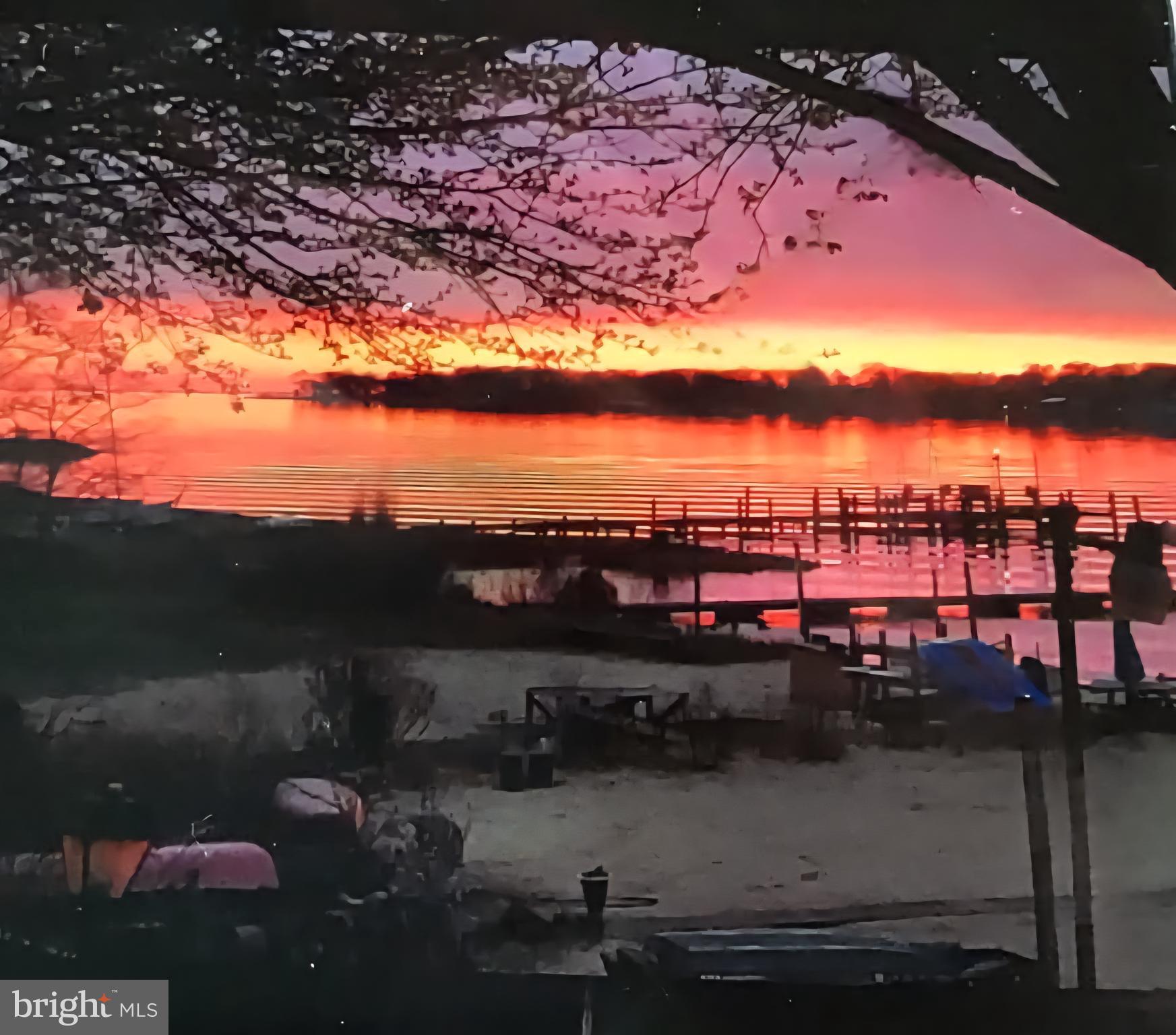 336 Bar Harbor Road Pasadena, MD 21122 - Photo 28 of 82 sunset picture taken thru sunroom window