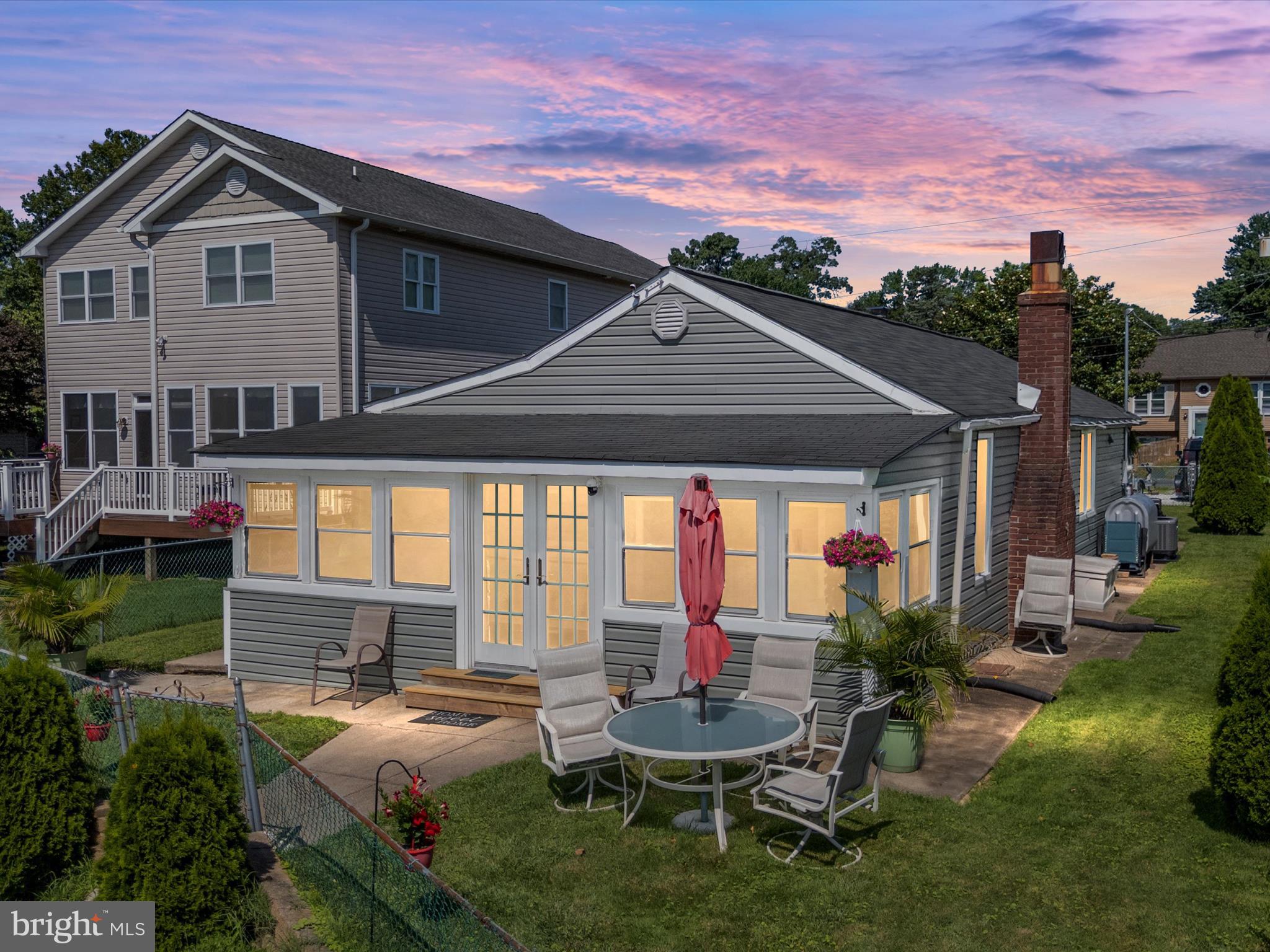 336 Bar Harbor Road Pasadena, MD 21122 - Photo 29 of 82 a backyard of a house with table and chairs