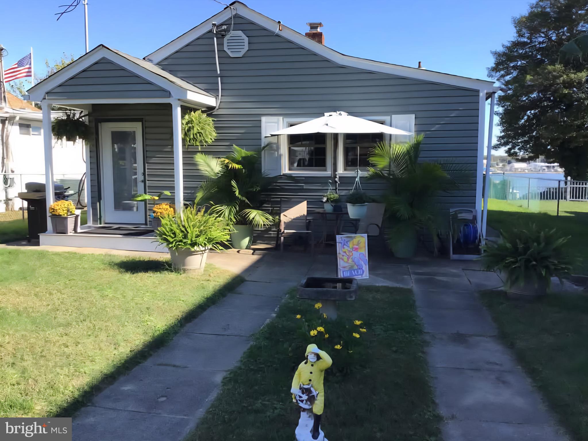 336 Bar Harbor Road Pasadena, MD 21122 - Photo 32 of 82 a front view of a house with garden