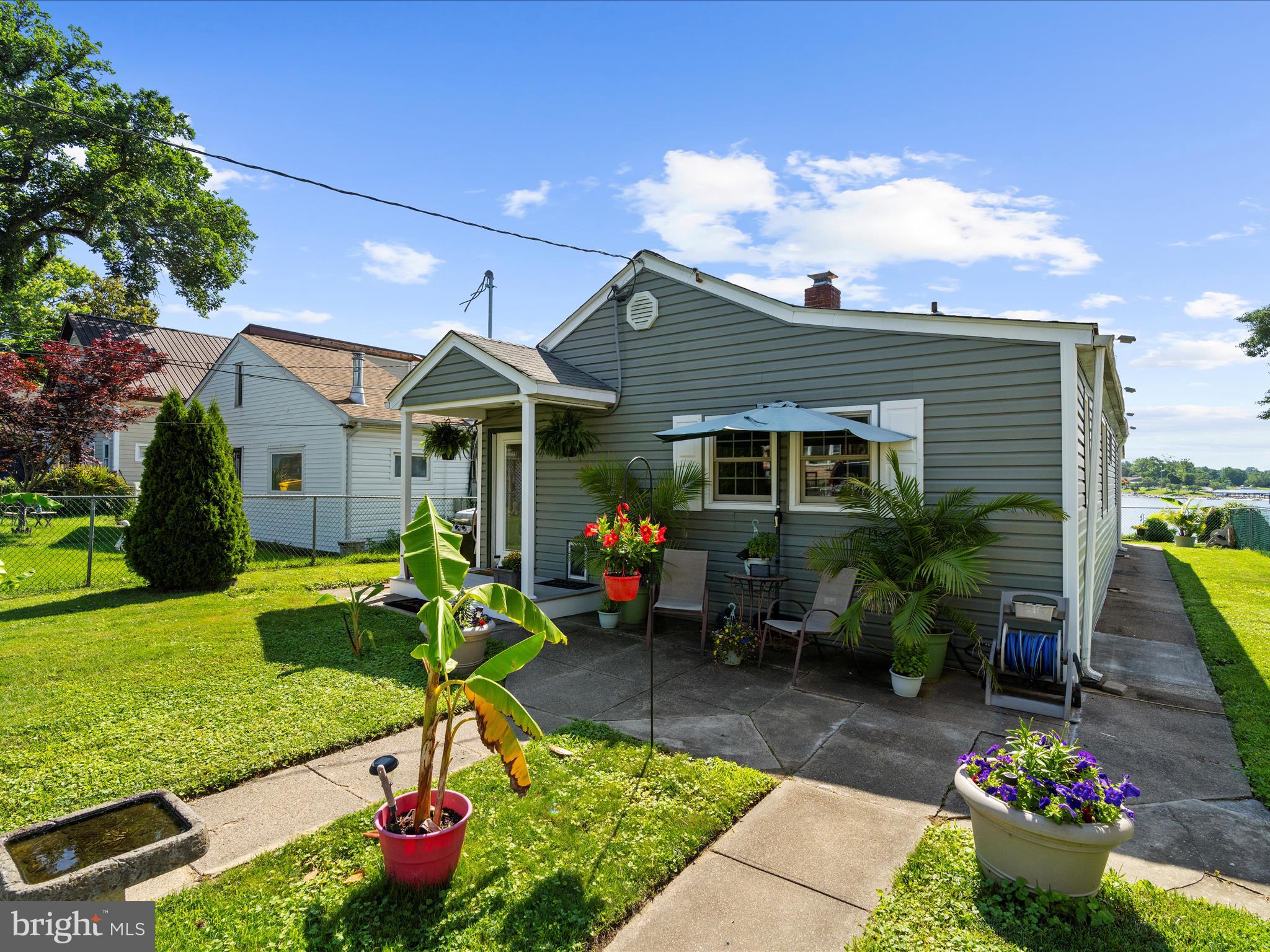336 Bar Harbor Road Pasadena, MD 21122 - Photo 37 of 82 a view of a house with backyard sitting area and swimming pool