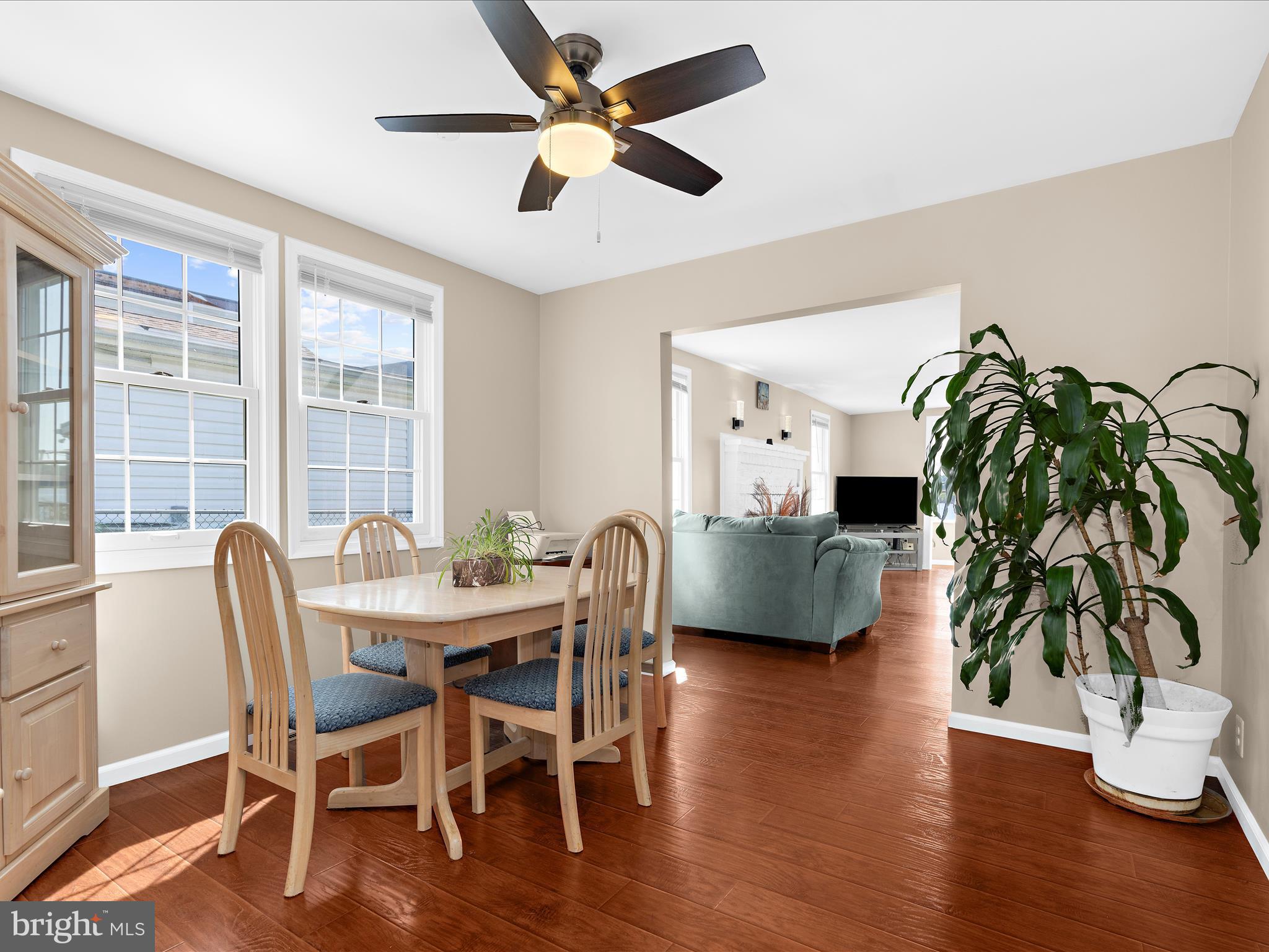 336 Bar Harbor Road Pasadena, MD 21122 - Photo 4 of 82 a dining room with furniture potted plants and wooden floor