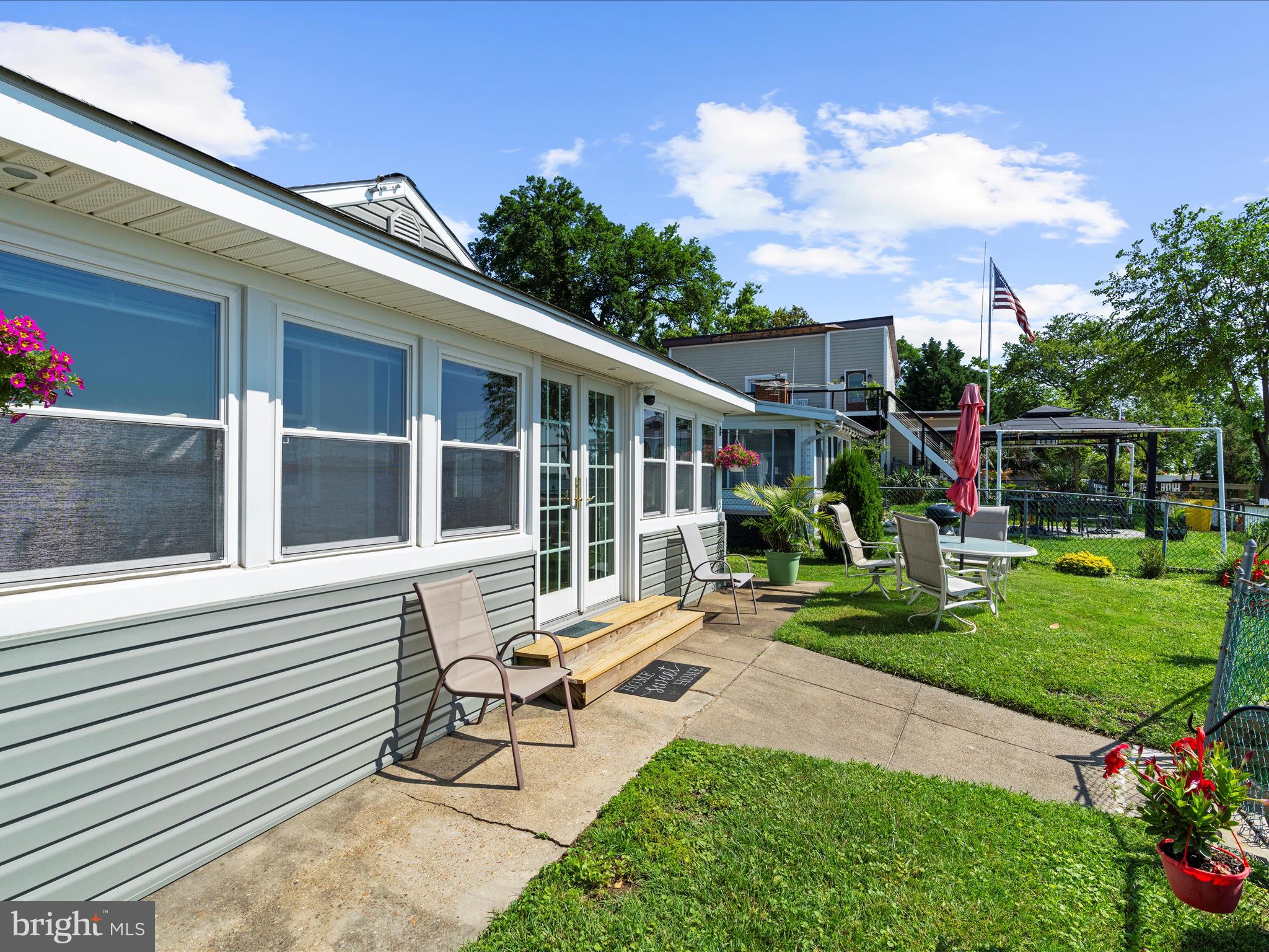 336 Bar Harbor Road Pasadena, MD 21122 - Photo 41 of 82 a view of a house with backyard sitting area and garden