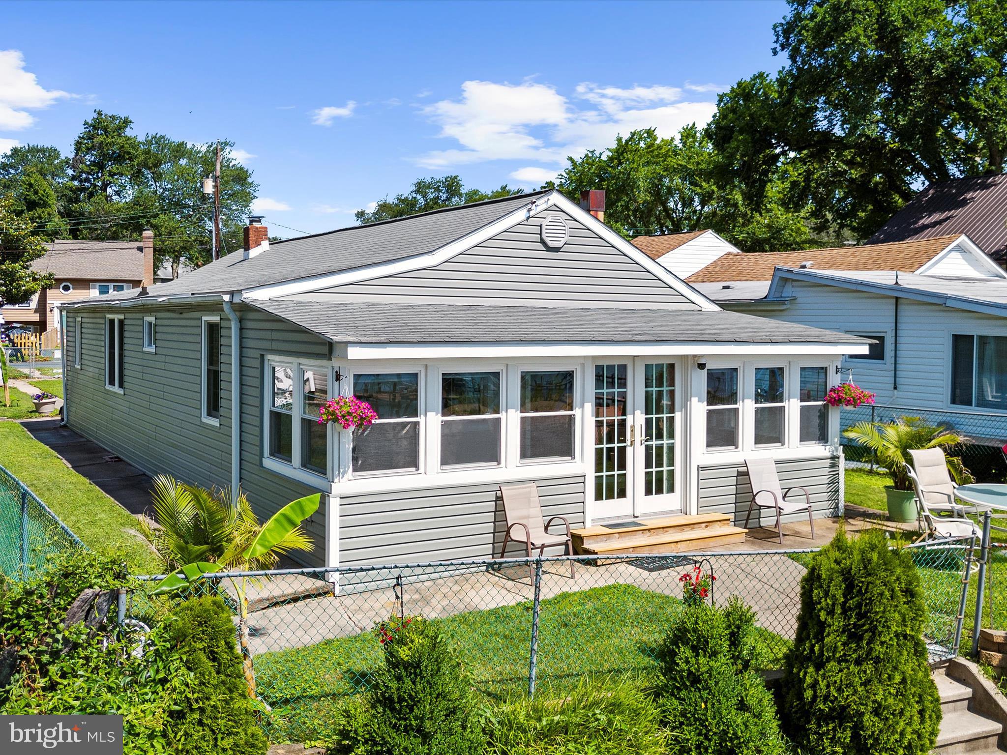 336 Bar Harbor Road Pasadena, MD 21122 - Photo 45 of 82 a view of a house with sitting area and garden