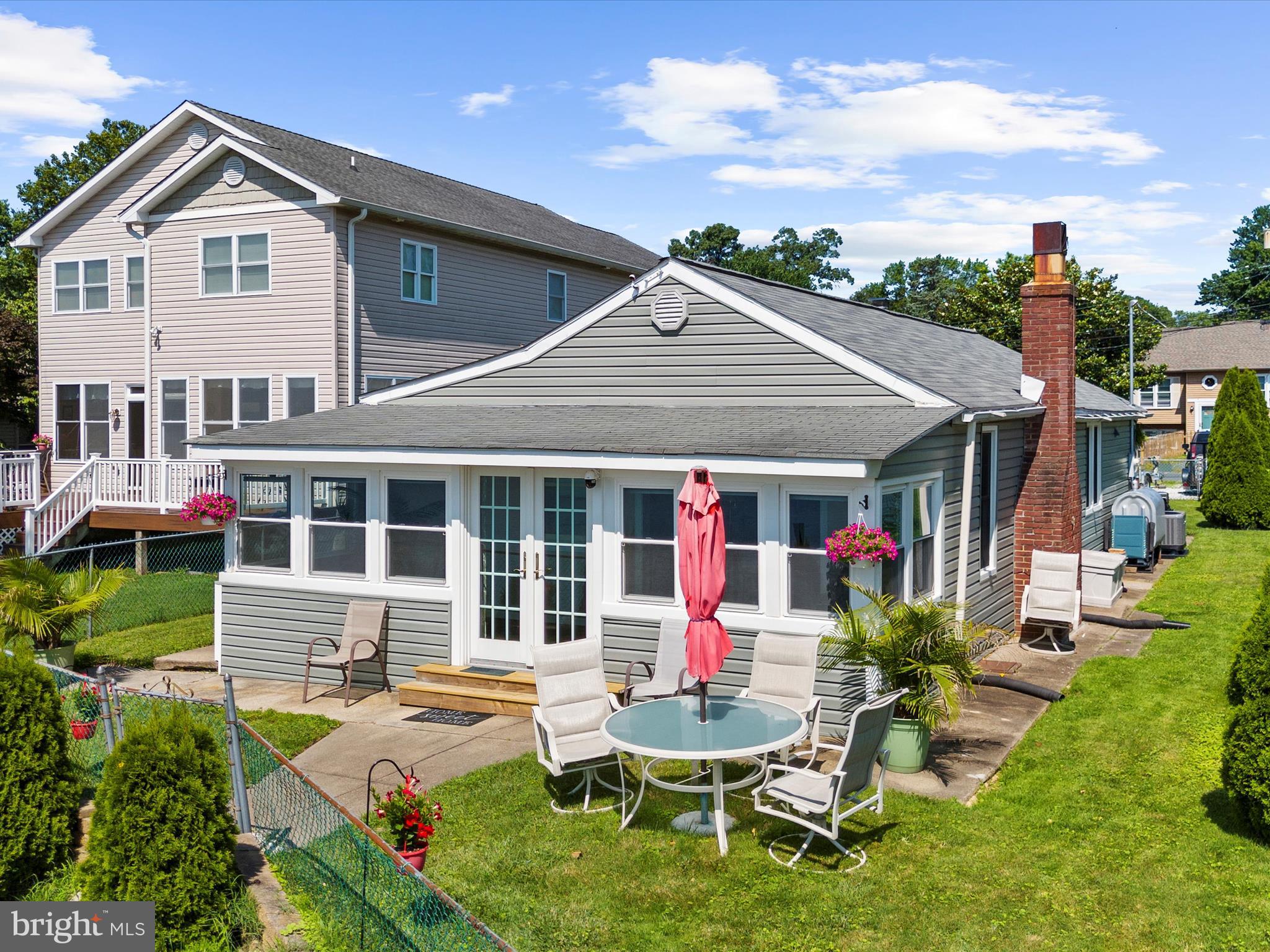 336 Bar Harbor Road Pasadena, MD 21122 - Photo 46 of 82 a view of a house with a yard patio and fire pit