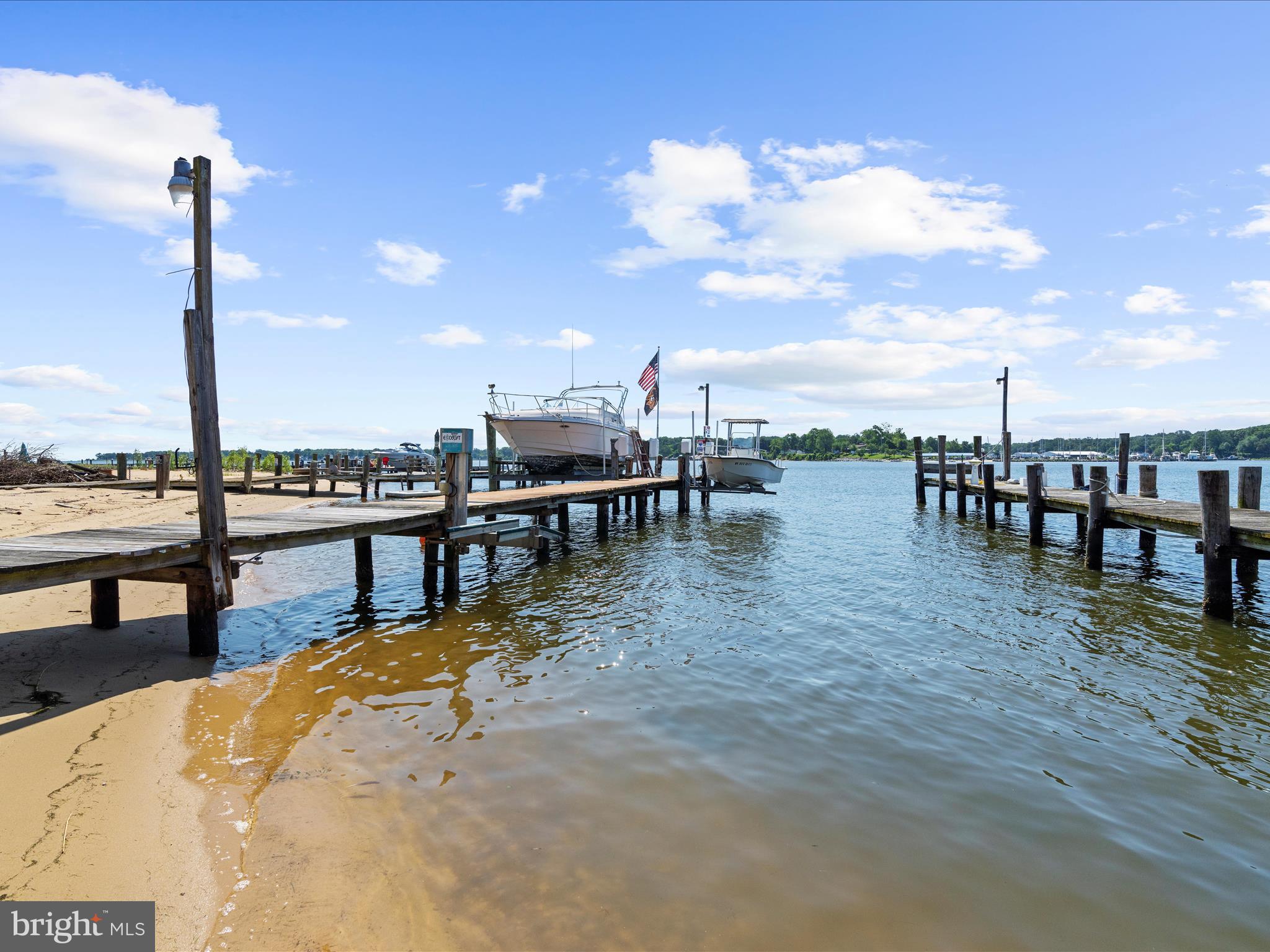336 Bar Harbor Road Pasadena, MD 21122 - Photo 54 of 82 a view of a swimming pool with a table and chairs