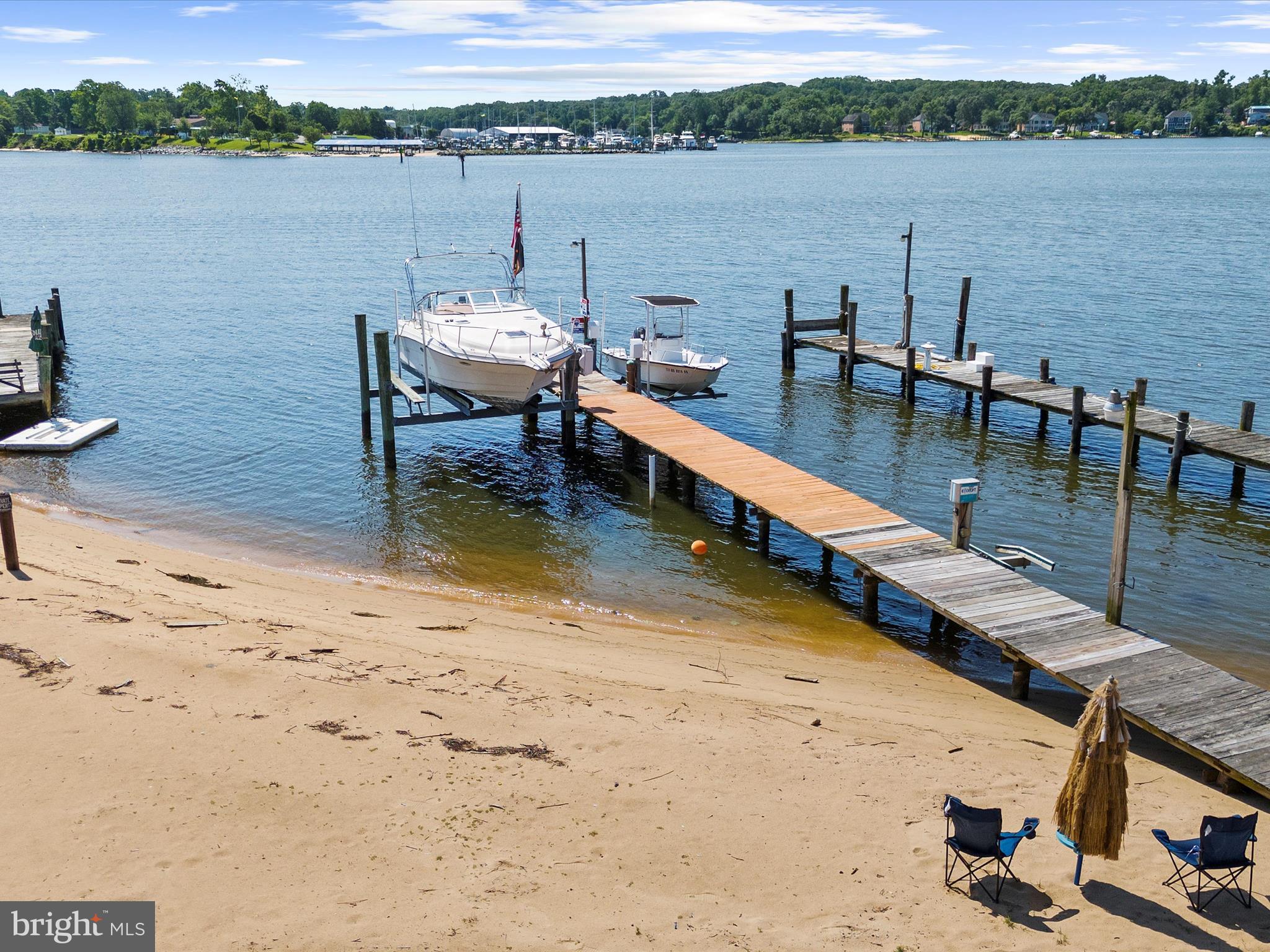 336 Bar Harbor Road Pasadena, MD 21122 - Photo 66 of 82 a view of a lake with a table and chairs