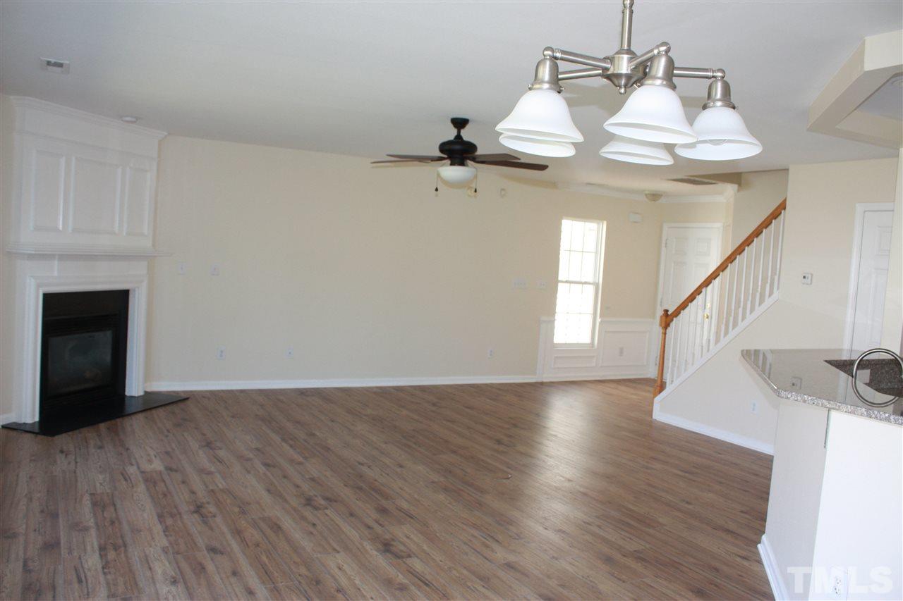 Family Room view from dining area.  New flooring on the first level, and wood flooring continues on the second level