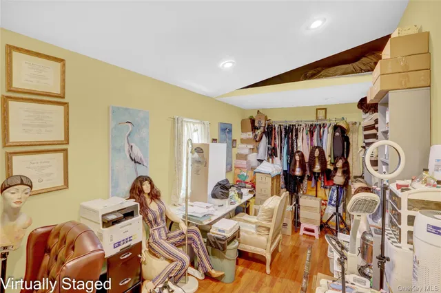 a view of walk in closet with clothes