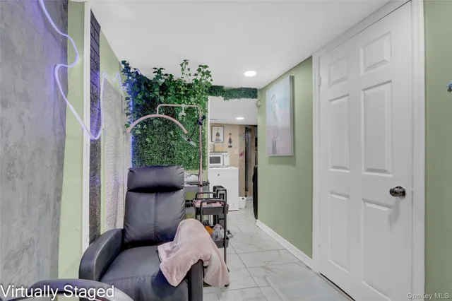 a view of a patio with a table and chairs under an umbrella