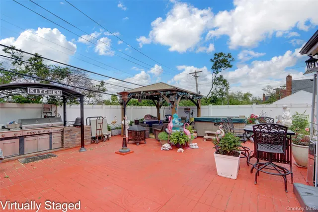 a view of a patio with table and chairs potted plants