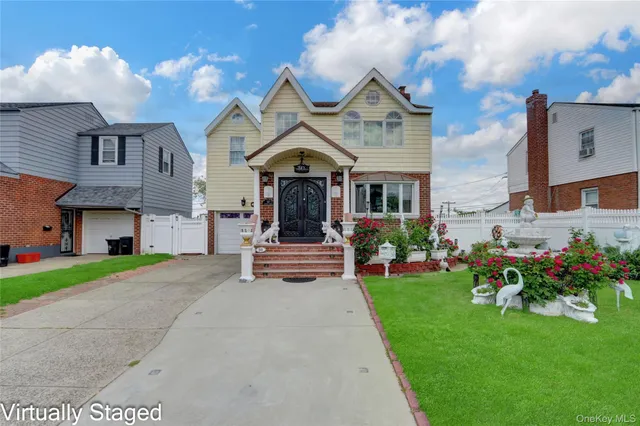 a view of a house with a big yard and potted plants