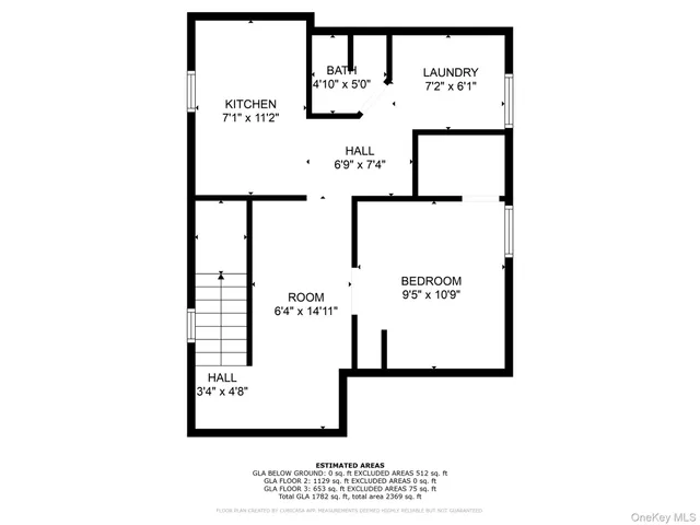 a picture of a bench in front of a wall