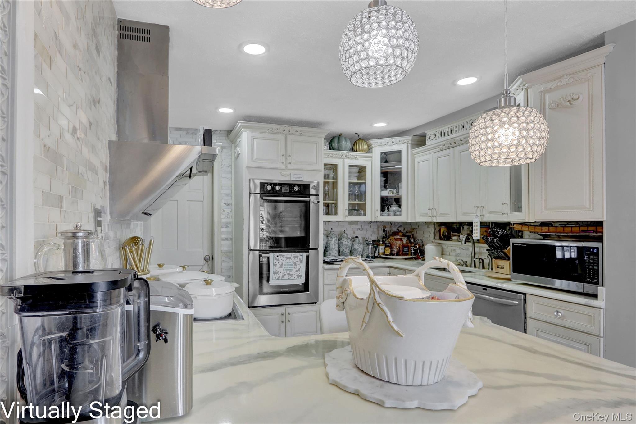 50 Crystal Street Elmont, NY 11003 - Photo 8 of 40 a large white kitchen with a large window and stainless steel appliances