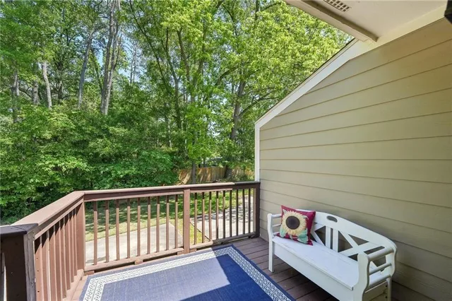 a view of balcony with wooden floor