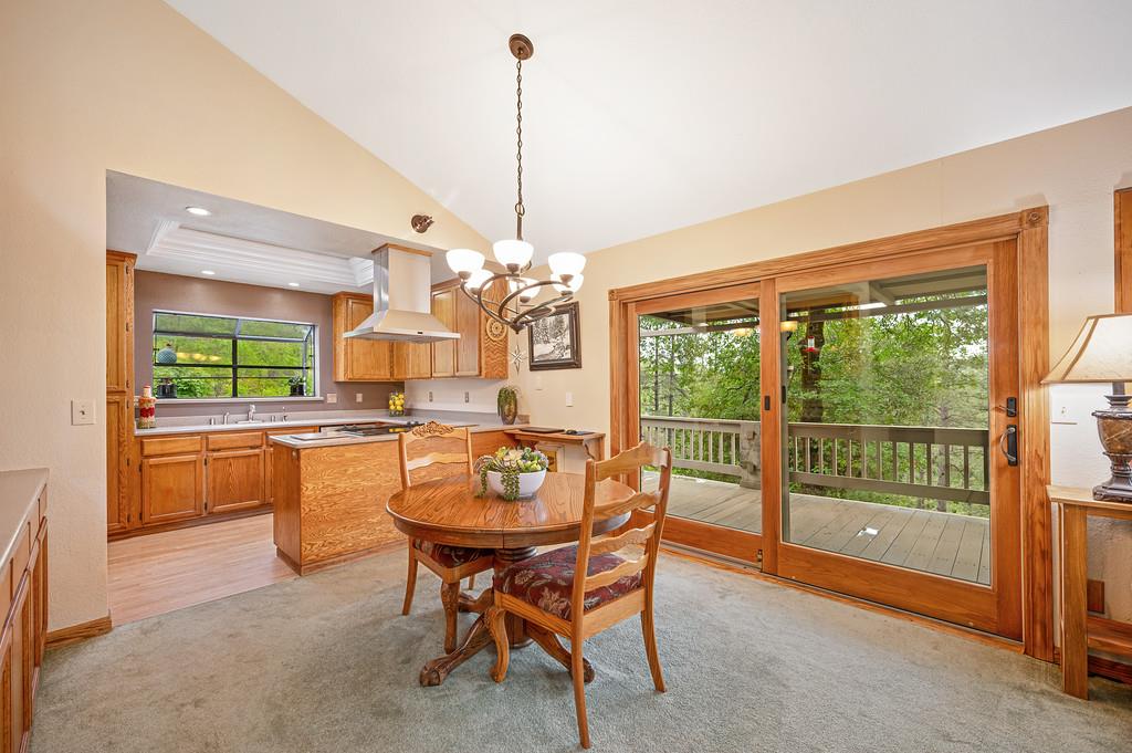 3971 Donner Trail Placerville, CA 95667 - Photo 21 of 78 a dining room with furniture a chandelier and window