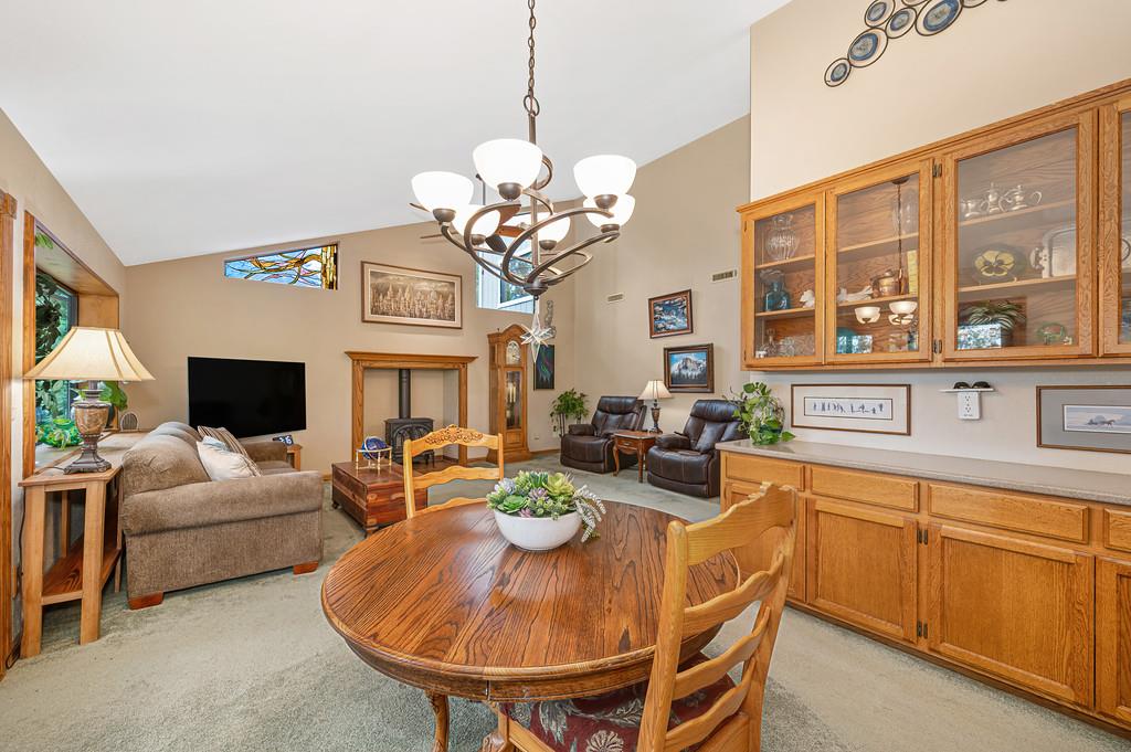 3971 Donner Trail Placerville, CA 95667 - Photo 23 of 78 a view of a dining room with furniture a chandelier and large windows