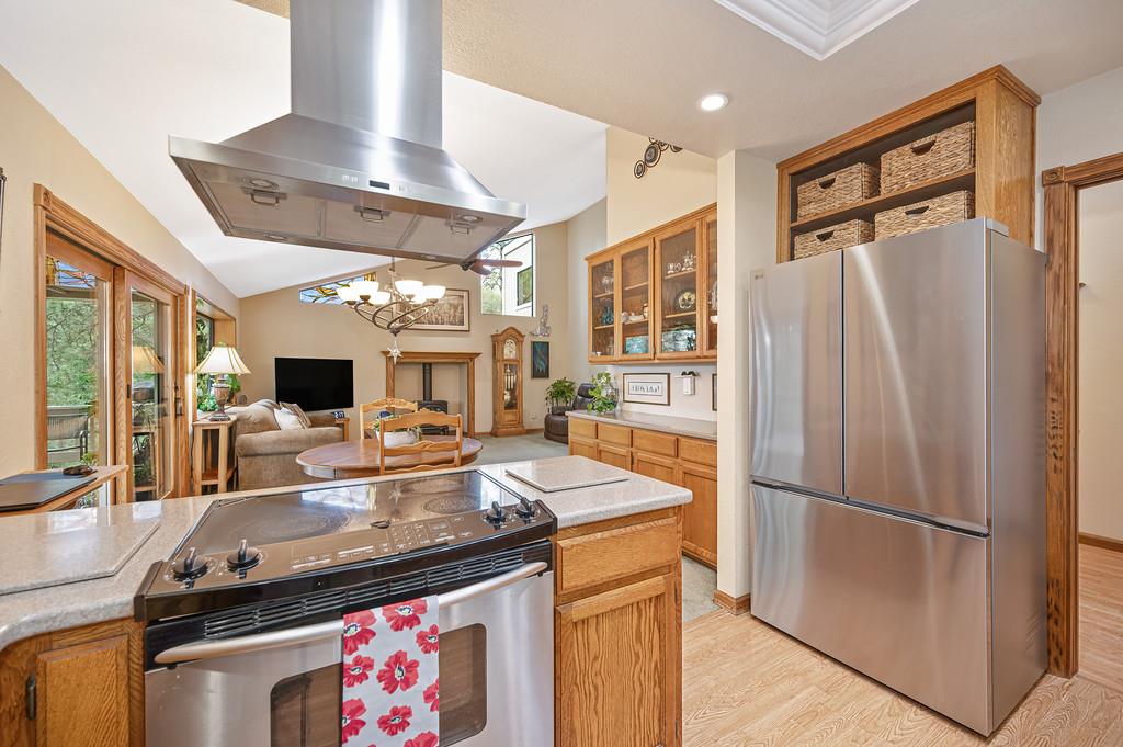 3971 Donner Trail Placerville, CA 95667 - Photo 26 of 78 a kitchen with stainless steel appliances granite countertop a refrigerator a stove and a sink with cabinets