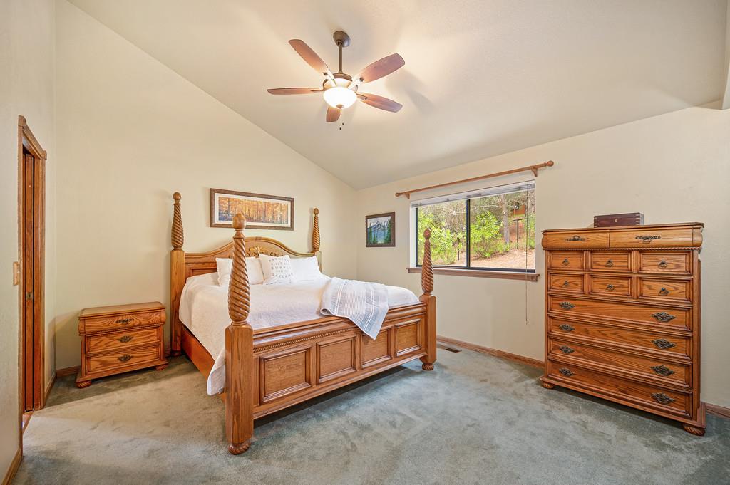 3971 Donner Trail Placerville, CA 95667 - Photo 28 of 78 a bedroom with a bed and a ceiling fan