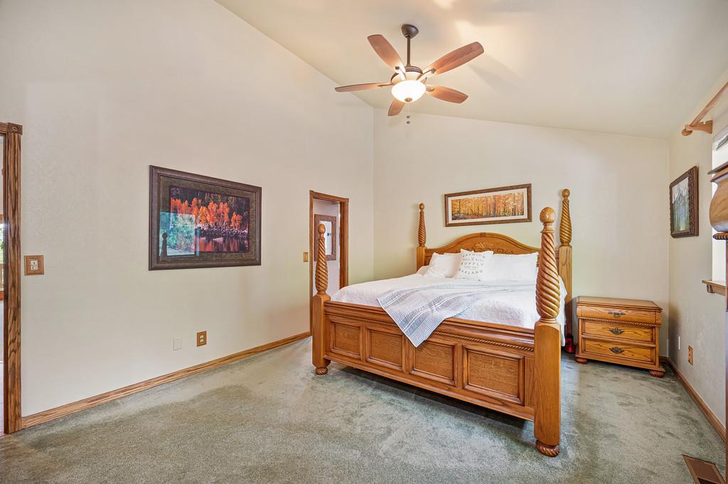3971 Donner Trail Placerville, CA 95667 - Photo 31 of 78 a bedroom with a bed and a chandelier