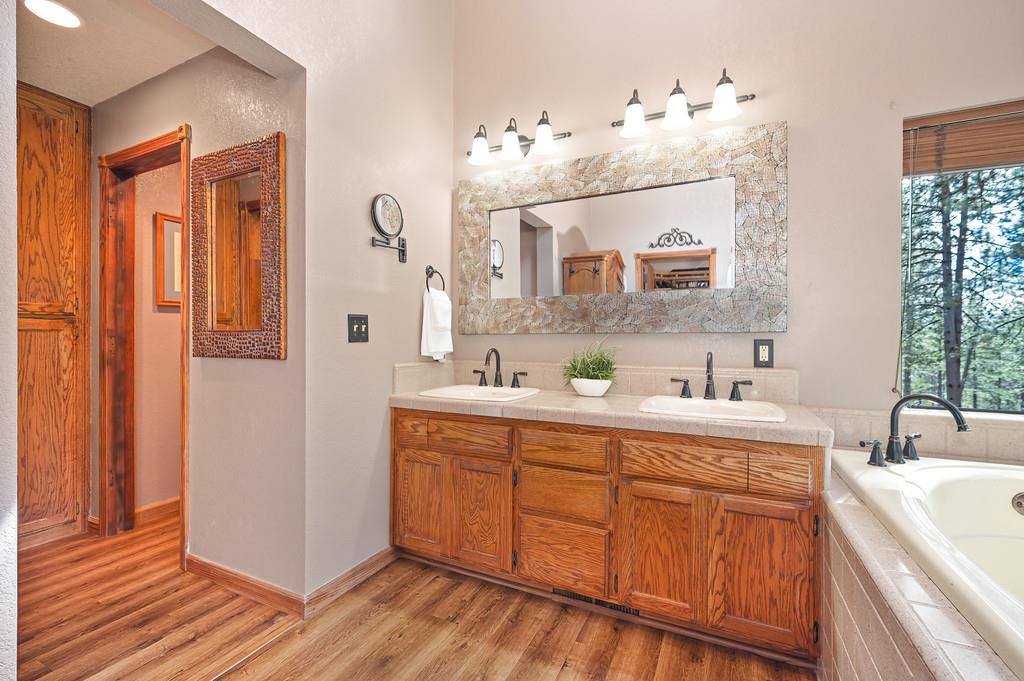 3971 Donner Trail Placerville, CA 95667 - Photo 34 of 78 a spacious bathroom with a double vanity sink mirror and
