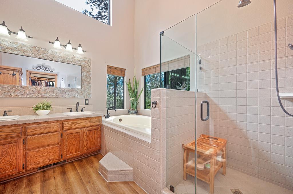 3971 Donner Trail Placerville, CA 95667 - Photo 35 of 78 a large white kitchen with a double vanity sink a window and a shower