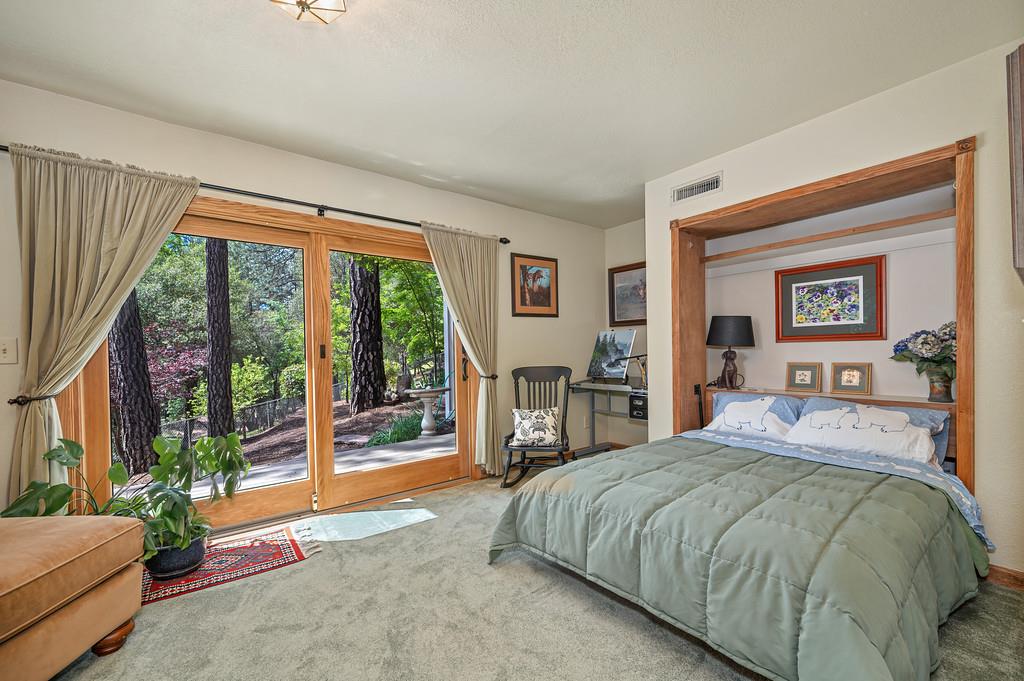 3971 Donner Trail Placerville, CA 95667 - Photo 39 of 78 a spacious bedroom with a large bed and a large window