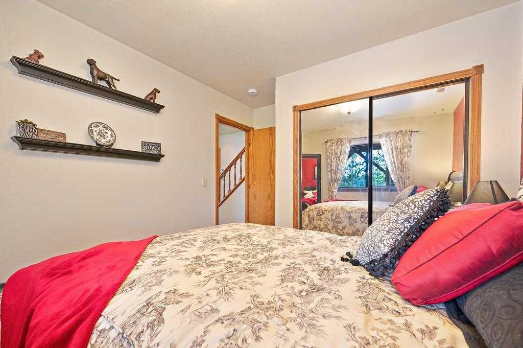 3971 Donner Trail Placerville, CA 95667 - Photo 44 of 78 a bedroom with a large bed and a large mirror