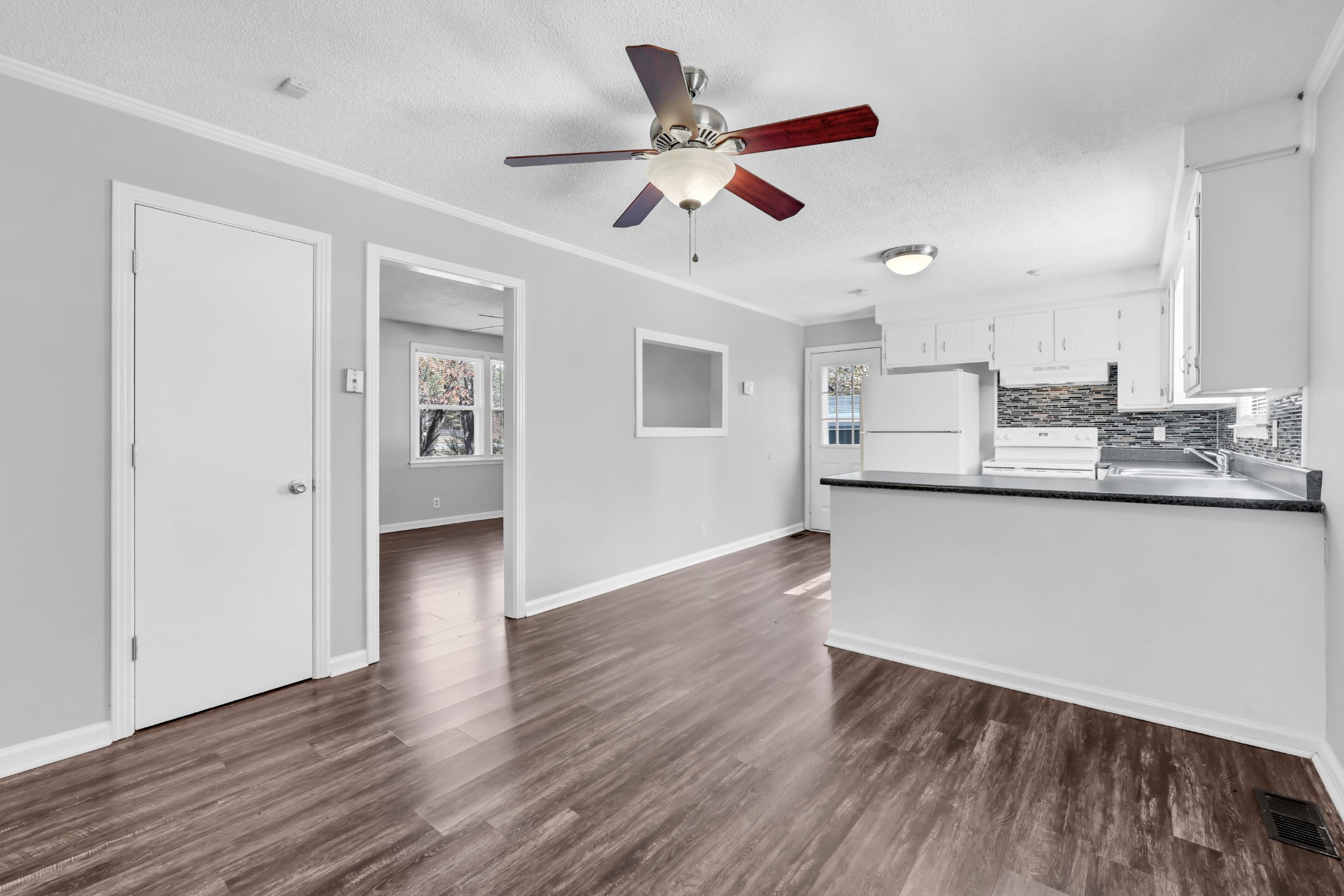 4660 Dover Road Indian Mound, TN 37079 - Photo 11 of 30 a kitchen with stainless steel appliances granite countertop a hardwood floor sink stove and granite counter top