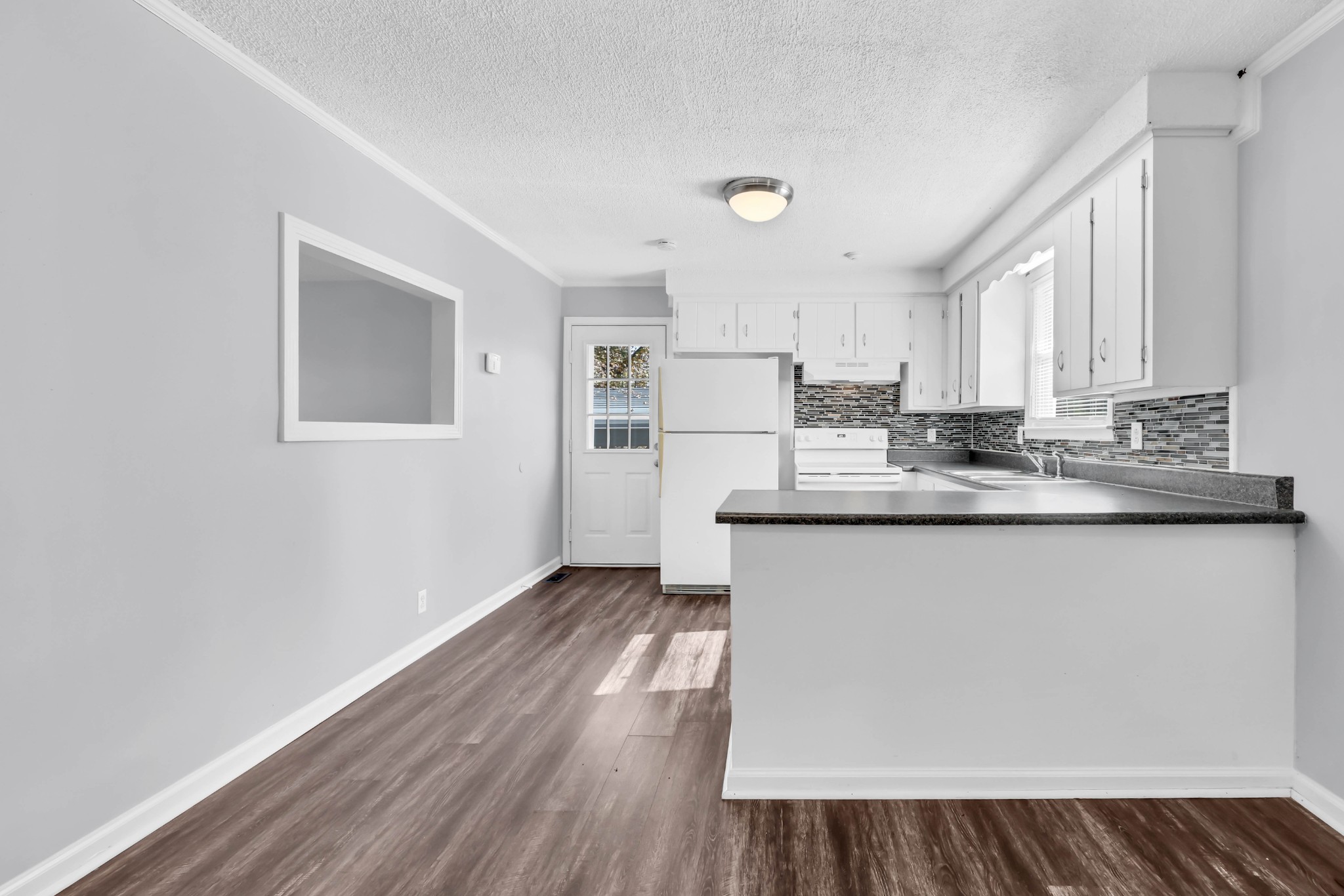 4660 Dover Road Indian Mound, TN 37079 - Photo 12 of 30 a kitchen with kitchen island a counter top space a sink stainless steel appliances and cabinets