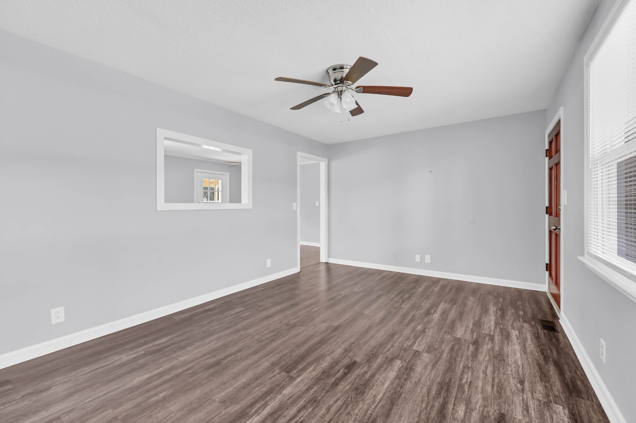 4660 Dover Road Indian Mound, TN 37079 - Photo 19 of 30 a view of an empty room with wooden floor and a window