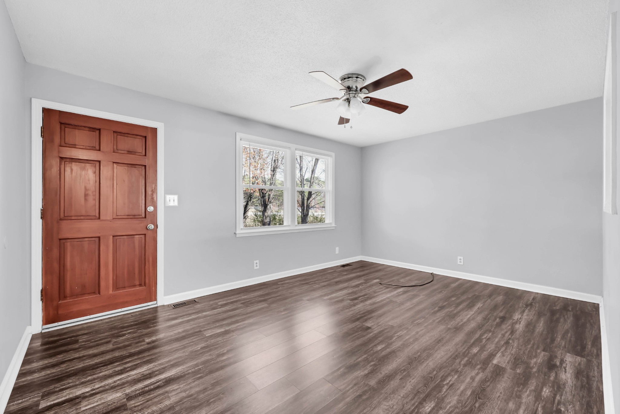 4660 Dover Road Indian Mound, TN 37079 - Photo 6 of 30 a view of an empty room with window and wooden floor