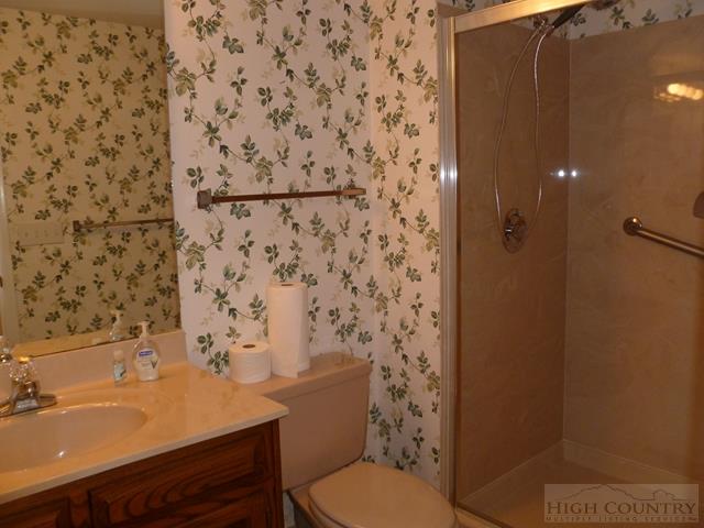 857 State Farm Road, Unit 103 Boone, NC 28607 - Photo 5 of 25 a bathroom with a sink toilet and shower