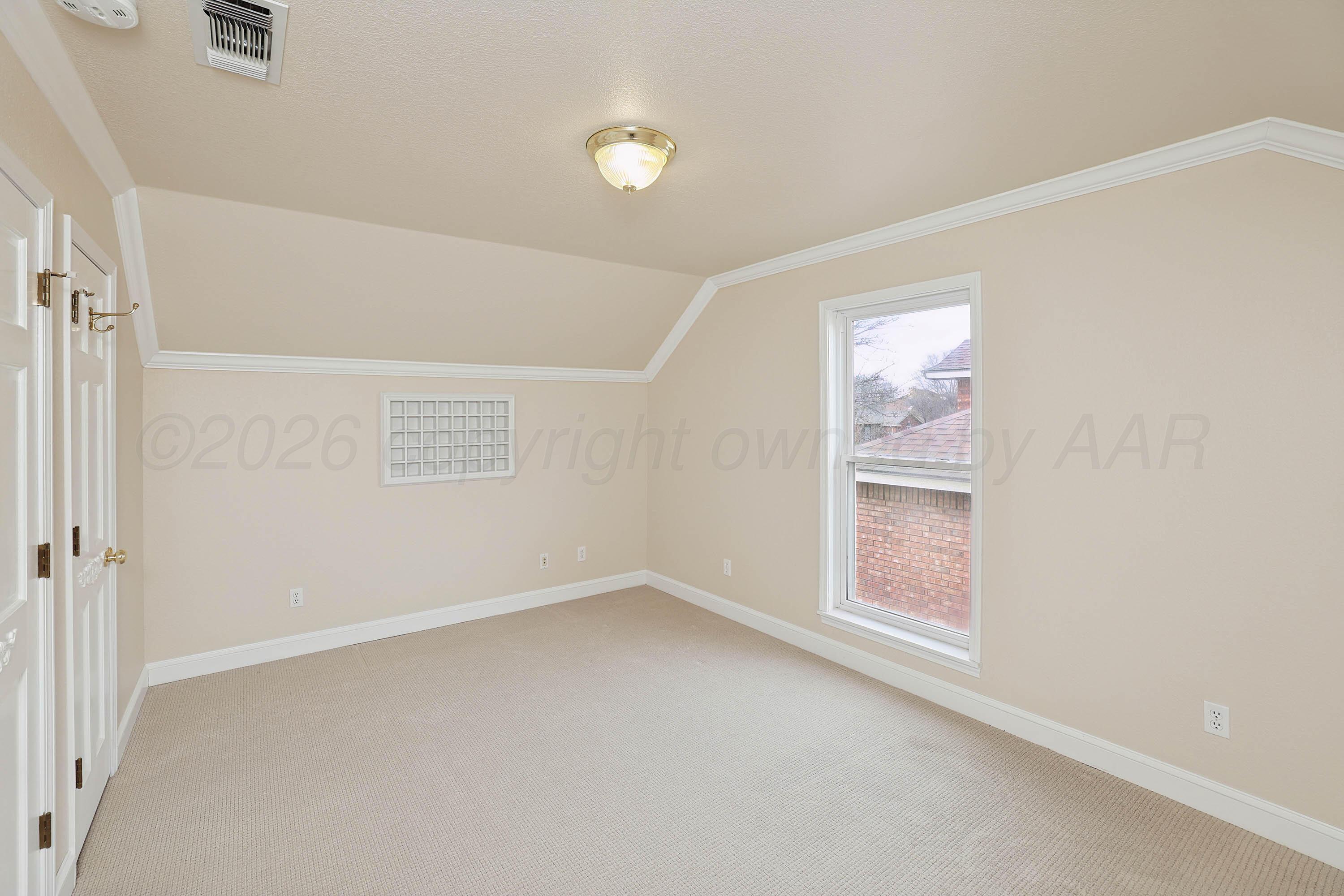 6904 Alpine Lane Amarillo, TX 79109 - Photo 28 of 45 an empty room with windows