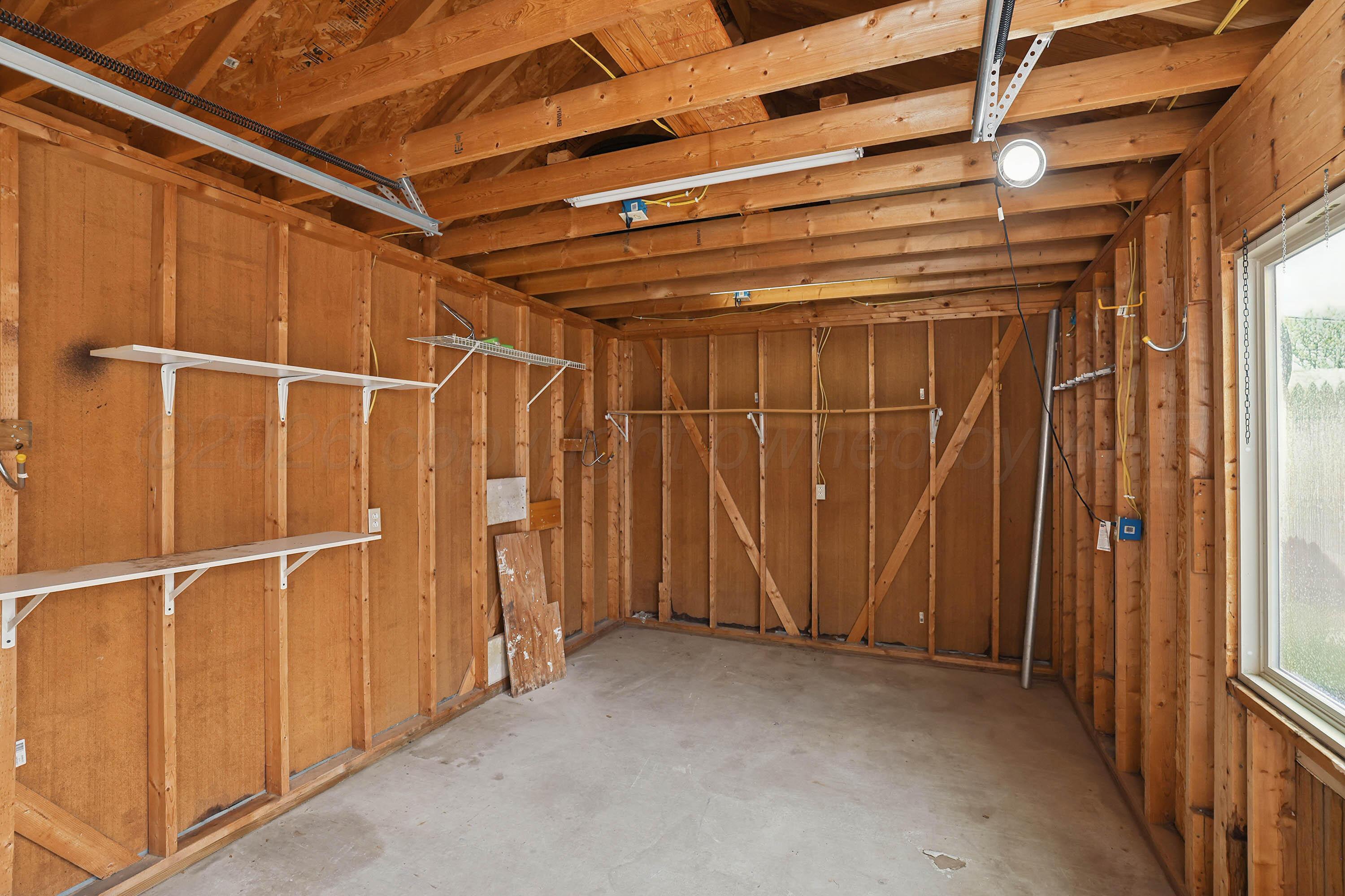 6904 Alpine Lane Amarillo, TX 79109 - Photo 43 of 45 a view of an empty room with a glass door