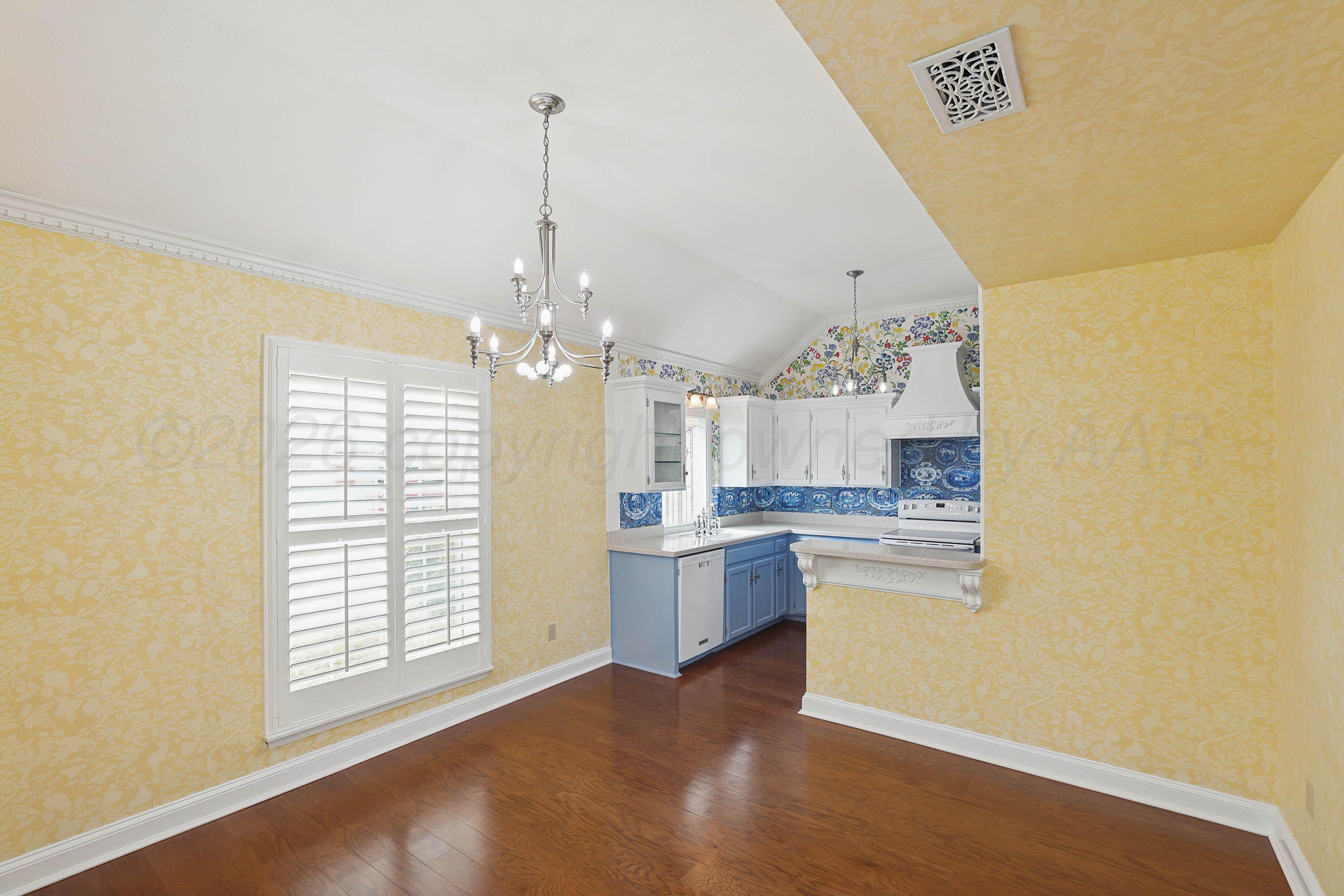 6904 Alpine Lane Amarillo, TX 79109 - Photo 6 of 45 a open kitchen with a sink stove and refrigerator