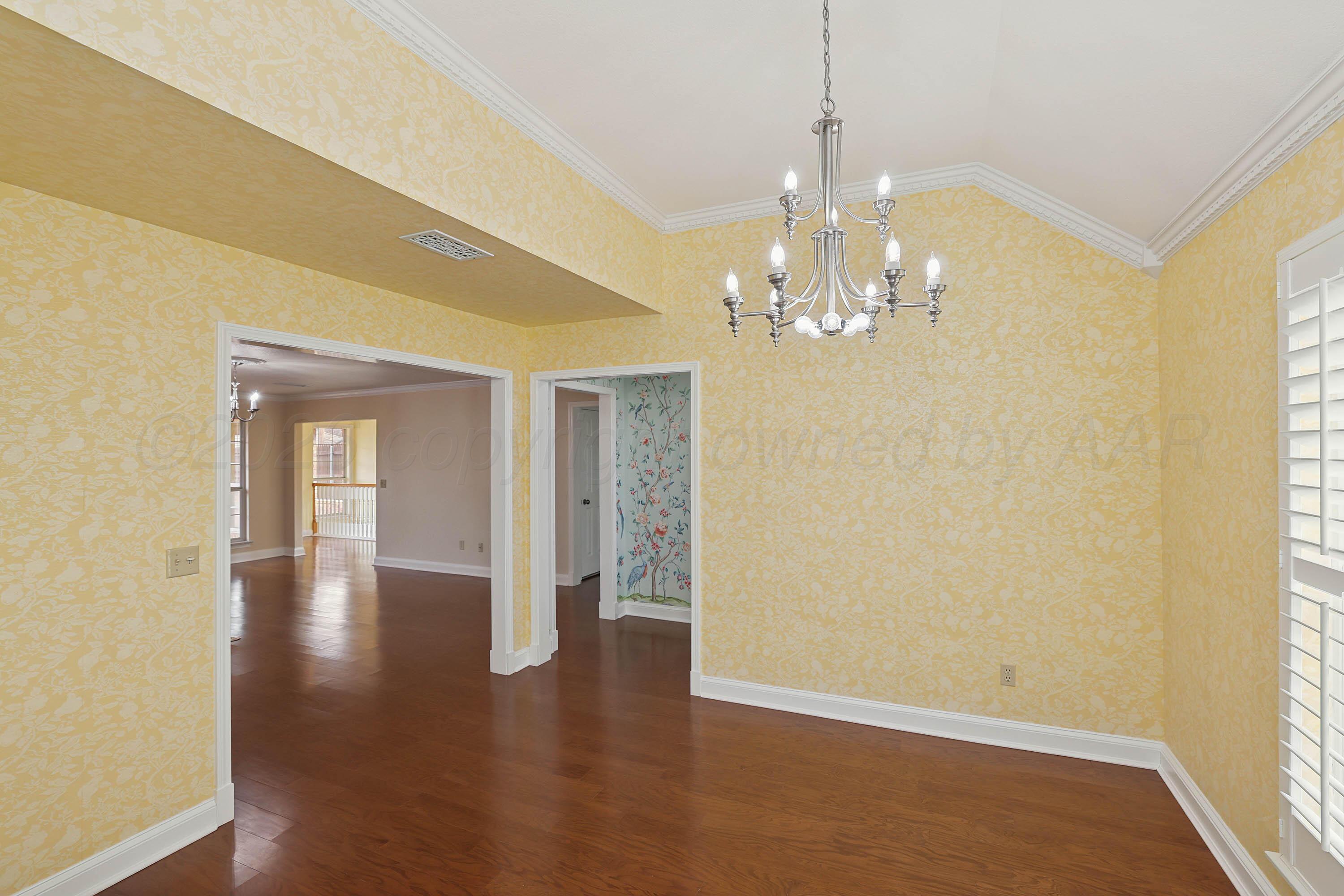6904 Alpine Lane Amarillo, TX 79109 - Photo 7 of 45 a view of a livingroom with a chandelier fan
