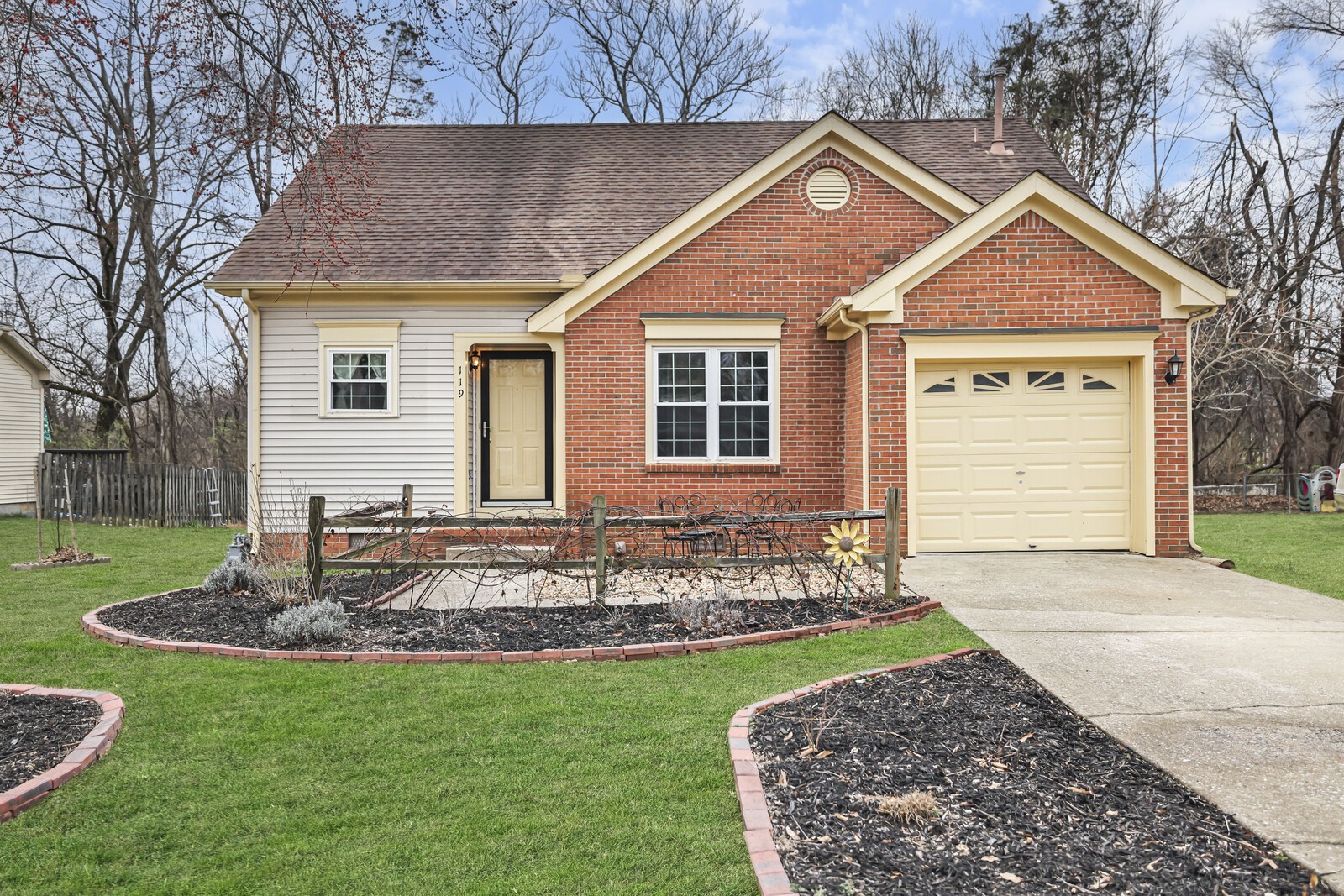 a front view of a house with garden