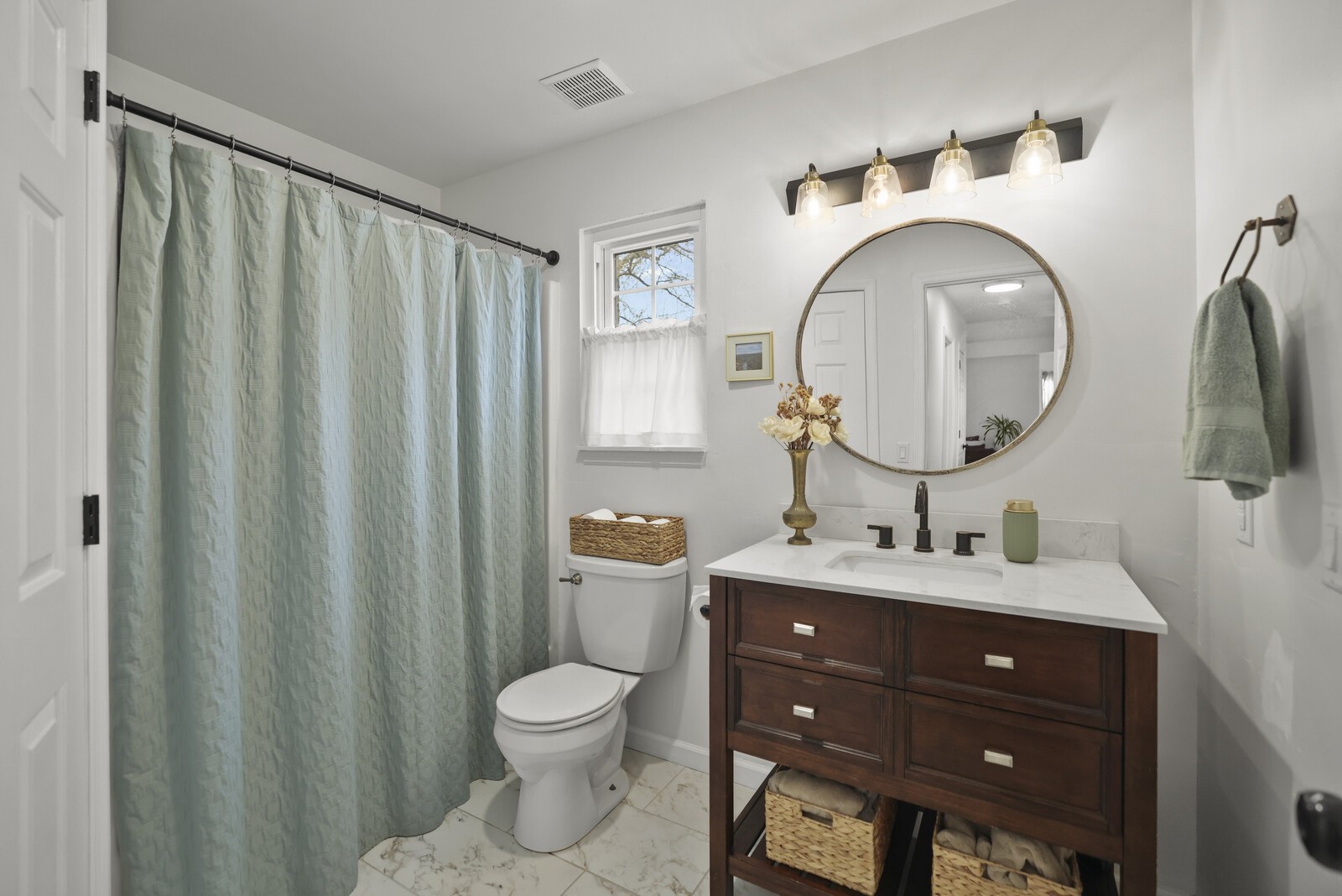 119 Pine Grove Road Mount Juliet, TN 37122 - Photo 21 of 37 a bathroom with a toilet a sink and a mirror