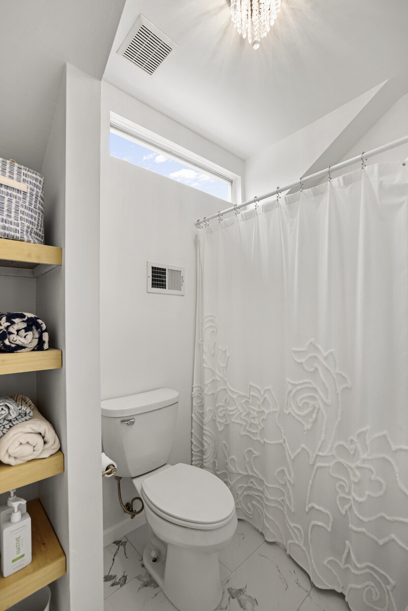119 Pine Grove Road Mount Juliet, TN 37122 - Photo 27 of 37 a white toilet sitting next to a bathroom sink
