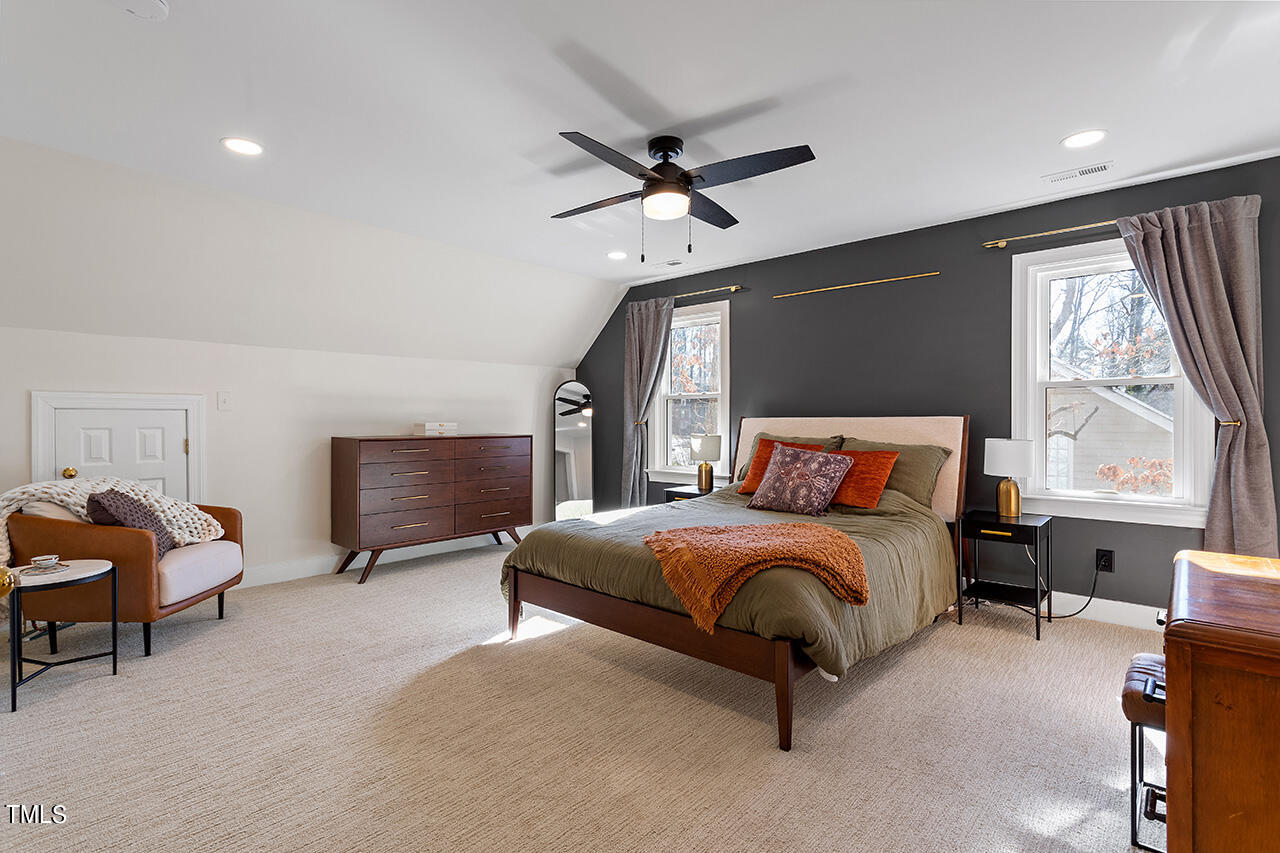 6933 Sandringham Drive Raleigh, NC 27613 - Photo 16 of 30 a bedroom with bed and window