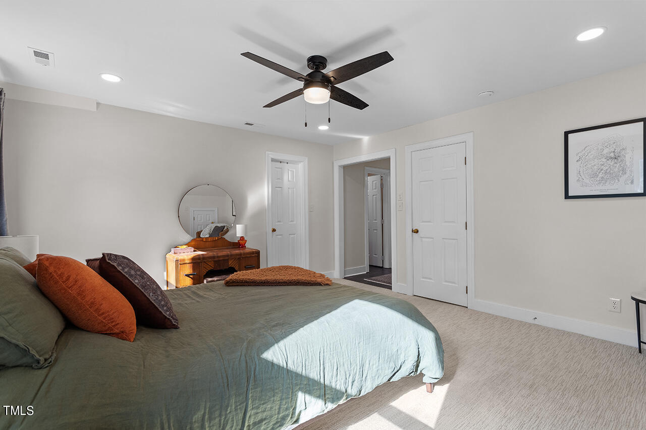 6933 Sandringham Drive Raleigh, NC 27613 - Photo 17 of 30 a bedroom with bed and window